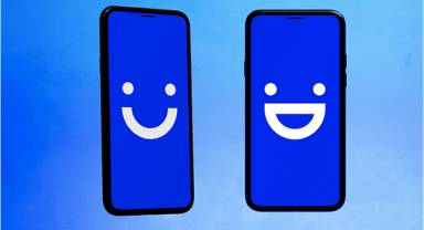 two visible phones with emoji icons on their screens