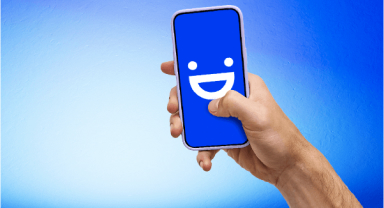 a visible phone held over a blue gradient background
