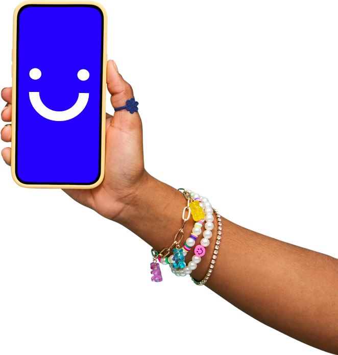 arm wearing colorful bracelets holding a visible phone