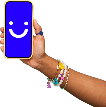 arm wearing colorful bracelets holding a visible phone