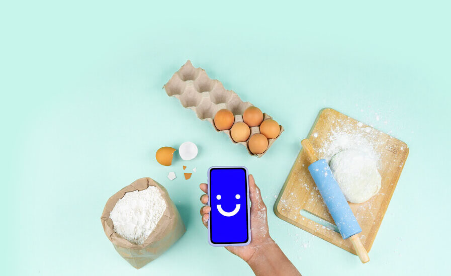 visible phone held over flour and eggs