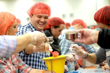 People helping out at a food shelter